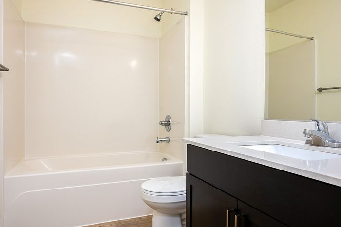 bathroom with shower and tub