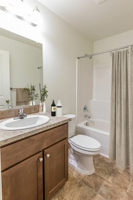 full bathroom with shower-tub combo at fairview court