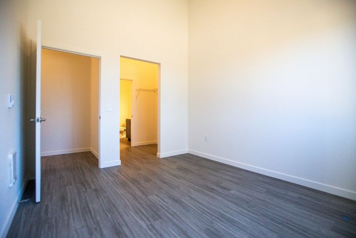 bedroom with faux wood like flooring at pacific ridge apartments