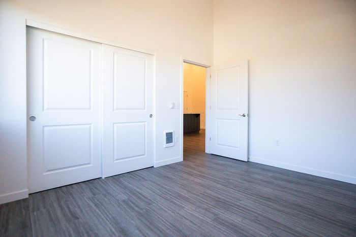 bedroom with faux wood like flooring at pacific ridge apartments