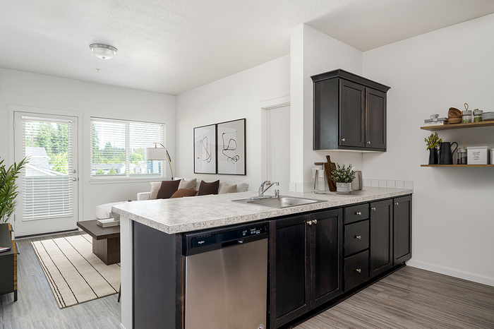 Virtually staged image of kitchen and living room at Alderbrook in Vancouver, WA