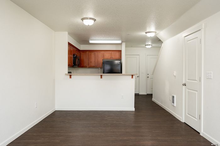 living area with fireplace and sliding glass doors leading to enclosed patio/yard