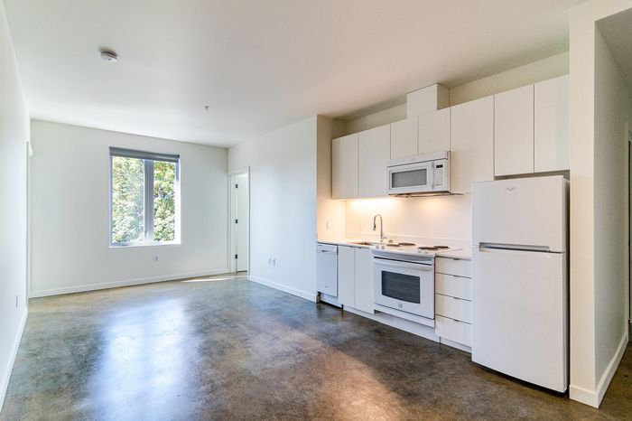 kitchen with white appliances and cabinetry at cassi