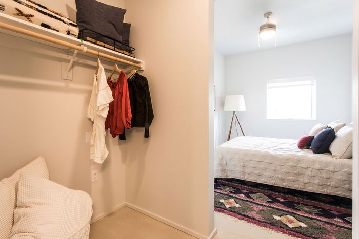 bedroom with walk in closet and bed in the background