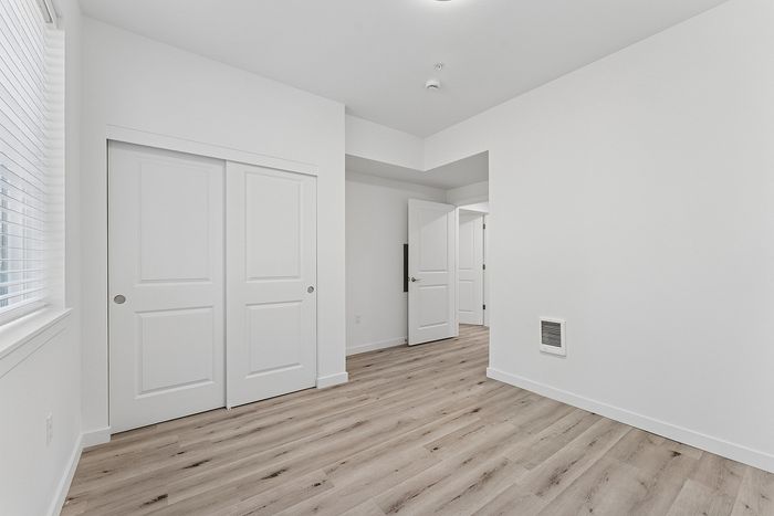 Spring Meadow bedroom with wood-style flooring