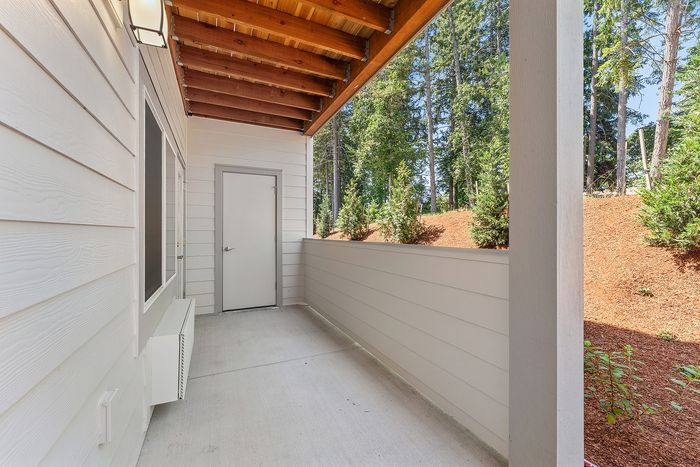 Outdoor patio of a two-bedroom apartment at Spring Meadow in Newberg, OR near George Fox University