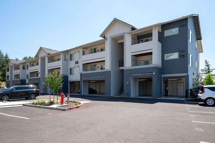 Exterior of Pacific Ridge with parking lot and garage parking available