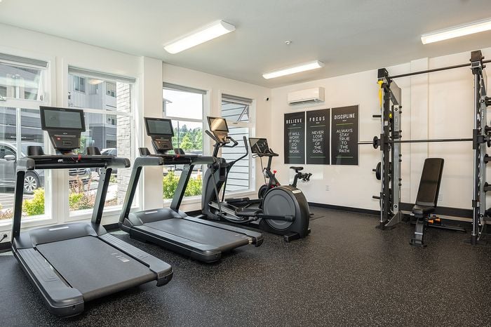 Fitness center with treadmills and stationary bike and weights