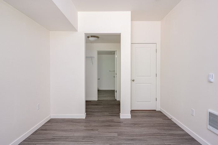 spacious bedroom with large closet leading to bathroom
