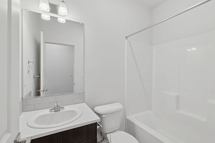 bathroom with bathtub and shower