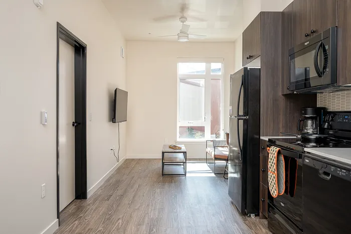 Fully Furnished One-Bedroom, One-Bathroom Floor Plan kitchen and living area