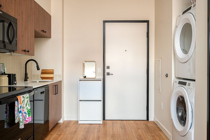 Fully Furnished One-Bedroom, One-Bathroom Floor Plan Kitchen and in-home washer & dryer