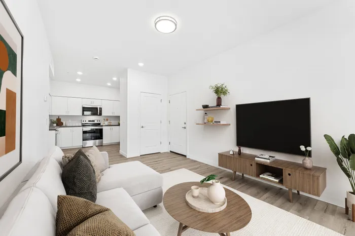 staged living room at Spring meadow with wood-style flooring and an A/C unit