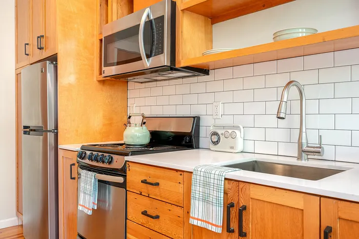 Kitchen with stainless steel appliances at Fairmount in Portland, OR