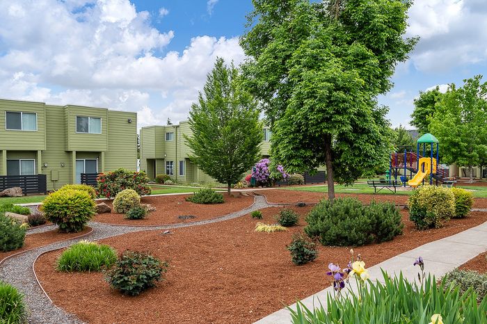 walking path and playground at boulder gardens apartments