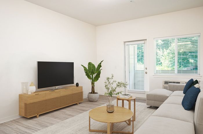 Tigard, OR, Apartments Near Bridgeport Village - Pacific Ridge Apartments - Living Area with Wood-Style Flooring, Couch, Nested Coffee Tables, Media Console, and Flat TV.