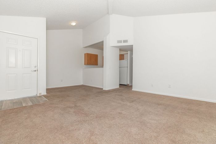 entrance to 2x1 with carpet and breakfast bar