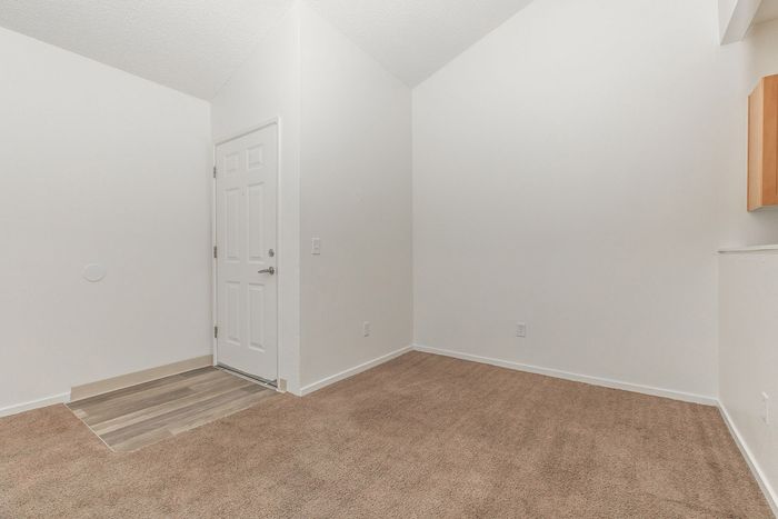 carpeted dining area and entrance