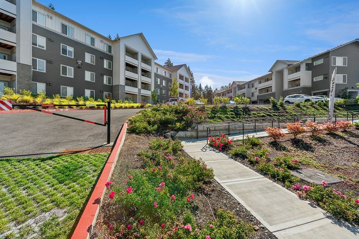 Exterior and lush landscaping at Pacific Ridge Apartments