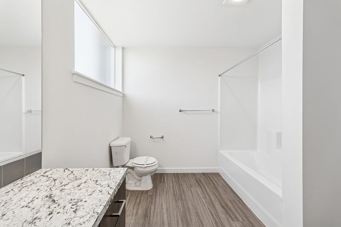 bathroom with shower and tub combo