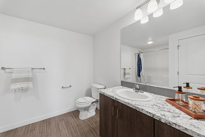 bathroom with vanity and tub shower combo