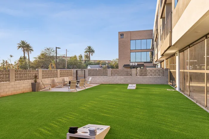 cornhole games and fire pit at asa apartments