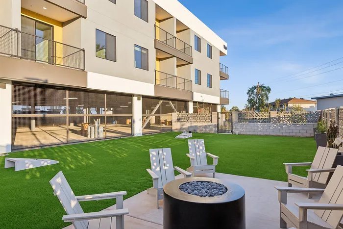 fireplace and cornhole area at asa apartments