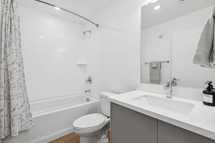 guest bathroom with tub and shower