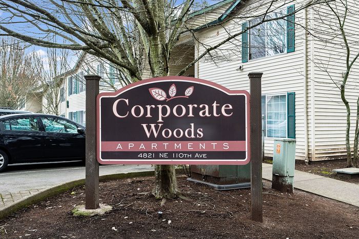 Corporate Woods Apartments wooden sign.
