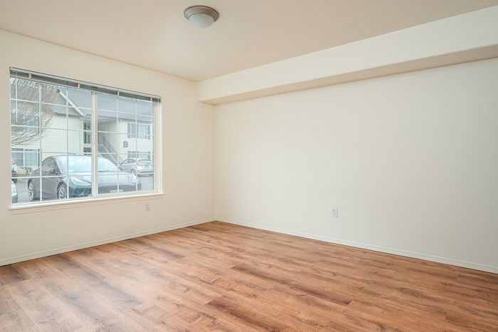 Ground floor bedroom with view of parking lot.