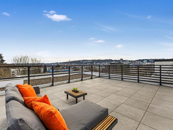 Comfortable rooftop lounge seating at Koz on 13th.