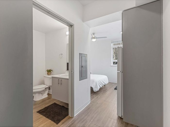 Studio apartment layout with luxury vinyl plank flooring at Koz on 13th.