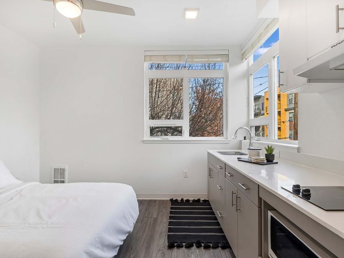 Modern kitchen featuring white quartz countertops at Koz on 13th.