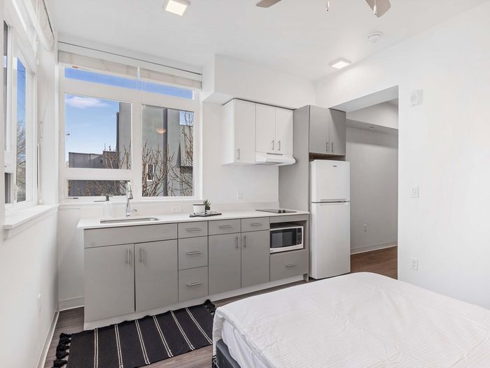 Sleek studio apartment with contemporary finishes at Koz on 13th.