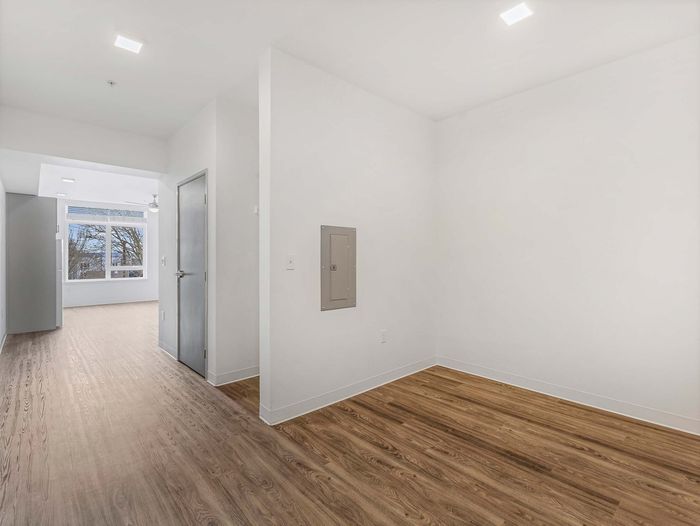 Bright, open apartment interior with modern lighting at Koz on 13th.