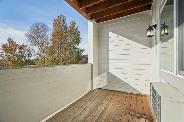 Wooden balcony overlooking trees