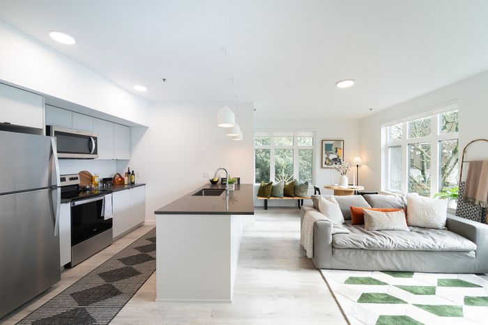 Living space with kitchen, living, and dining area.