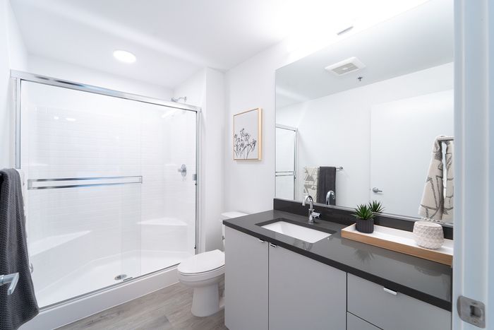 Bathroom with shower, toilet, and sink
