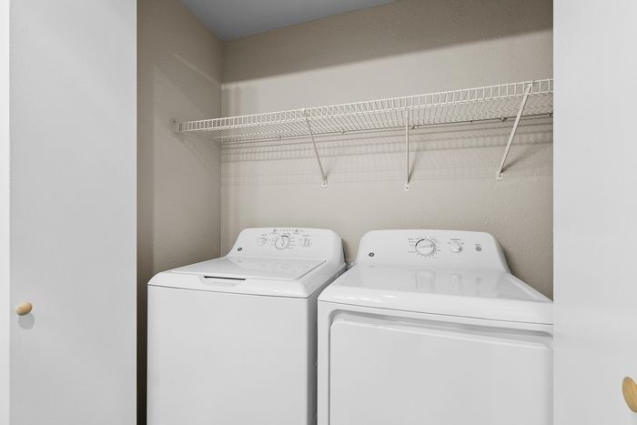 washer and dryer at Timber Flats with storage shelf