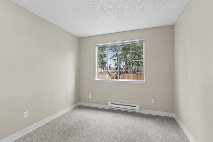bedroom 2 in C1 renovated floorplan at Timber Flats with window