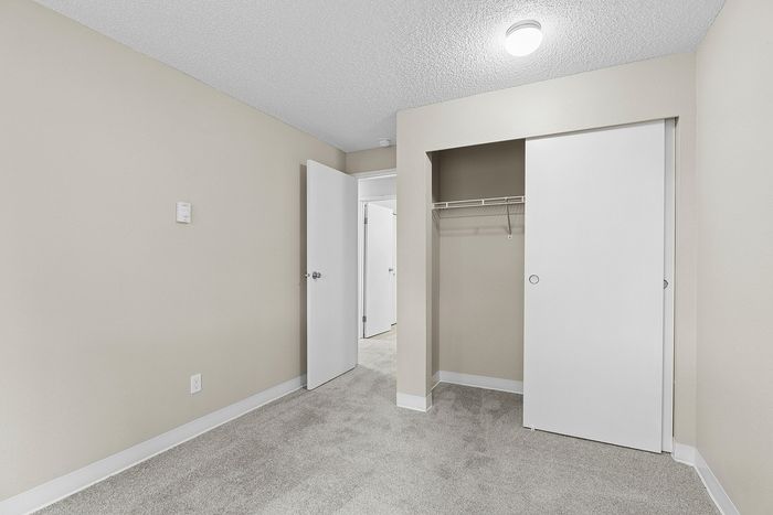 bedroom 2 of C1 renovated floorplan at Timber Flats closet view