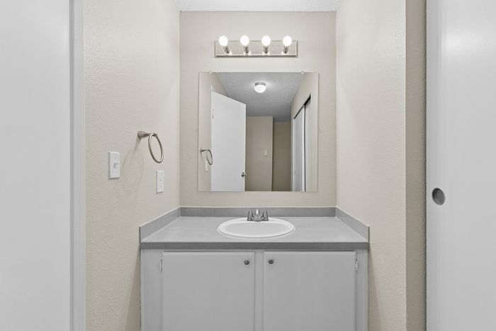 bathroom 2 in C1 renovated floorplan at Timber Flats wink area with mirror