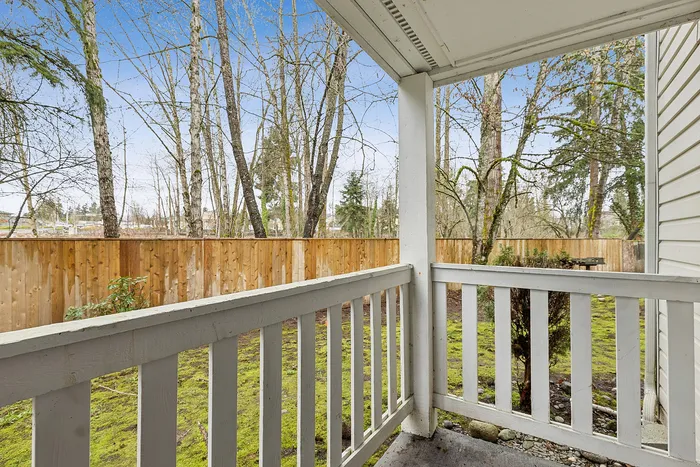patio view at Timber Flats in C1 renovated floorplan enclosed patio with grass area and fence