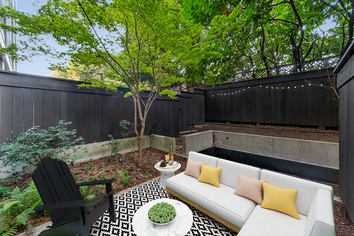 patio at Artisan with couch and fenced in area
