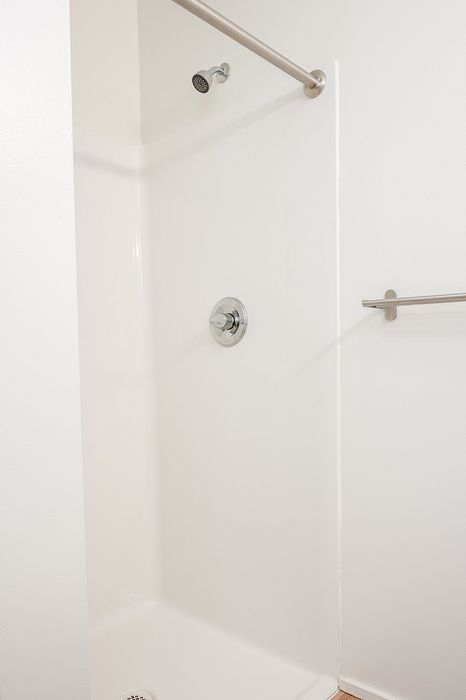 One-Bedroom at Lyra Apartments - walk-in shower with towel rod