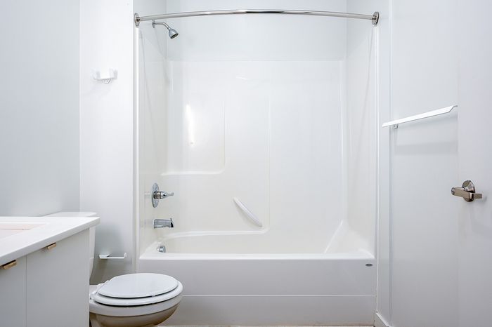 Cassi Apartments - bathroom with shower/tub white countertops and cabinets