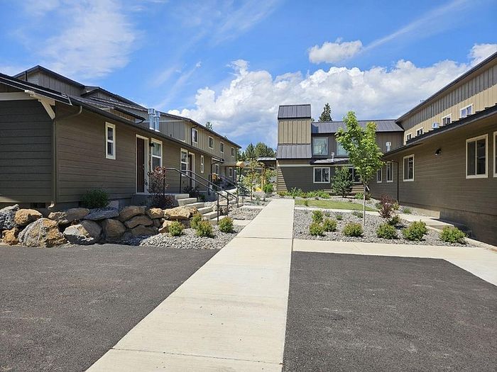Shared courtyard and asphalt parking area at Lakeside Place.
