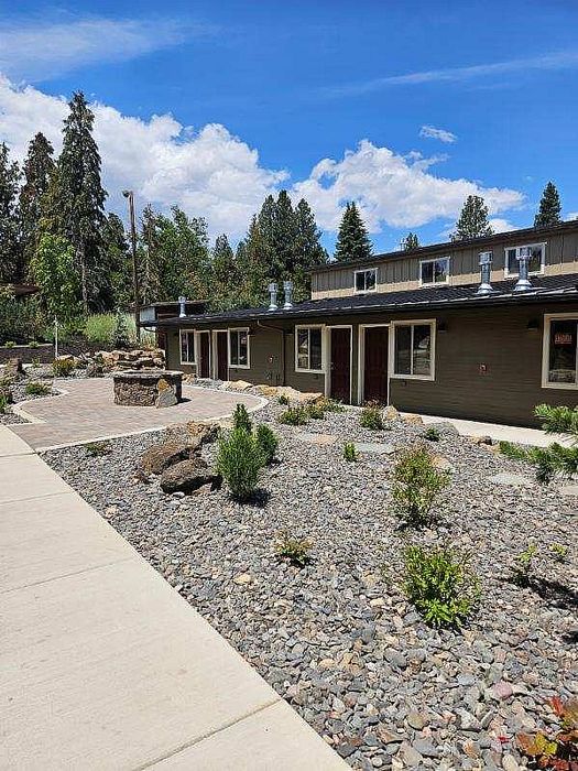 Native rock landscaping and contemporary exterior at Lakeside Place.