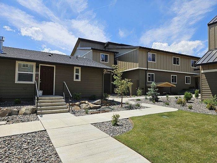 Private unit entrance with professional landscaping at Lakeside Place.