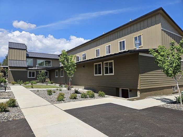 Expansive apartment building with large windows at Lakeside Place.